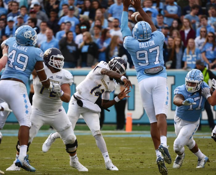 North Carolina Tar Heels defensive tackle Jalen Dalton (97) knocks down the pass of Western Carolina quarterback Tyrie Adams (12). Mandatory Credit: Rob Kinnan-USA TODAY Sports